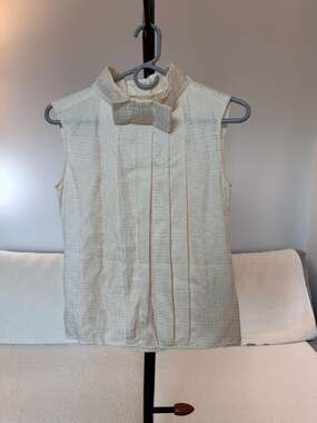 Designer Silk Pleated Sleeveless Blouse with Bow Collar and CC Globe Buttons
